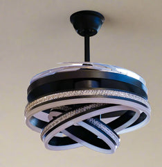 MR Homes Lite Sparrow remote-controlled ceiling fan with 4 blades, featuring forward and reverse rotation, in a modern living room.